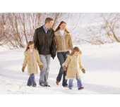 Picture of a family walking through the snow