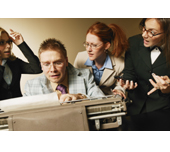 Picture of coworkers arguing around a typewriter