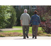 Picture of a man and a woman walking and holding hands
